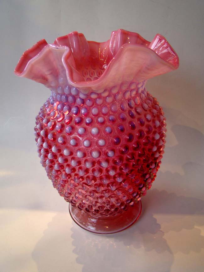 A vintage cranberry glass hobnail pattern 8" vase